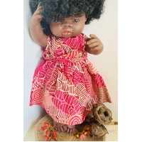Doll dressed in Bushmelon Pink Dress with Bow